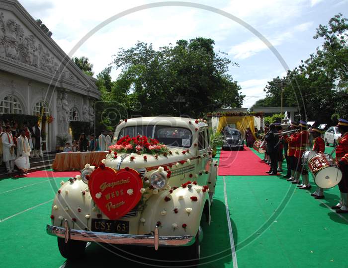A Classic Car decorated with flowers during wedding