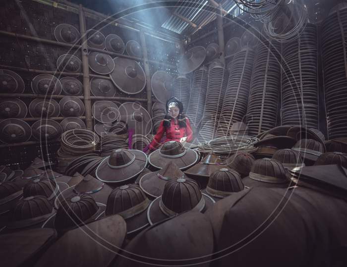 Asian Female Craftsman Making The Traditional Hat In The Old Traditional House In Inle Lake Village, Shan State, Myanmar, Traditional Artist Concept