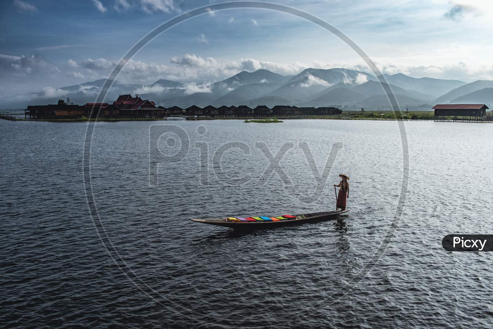 A Woman With Handcrafted Colorful Lotus Fabrics On Her Boat In In Dain Khone Village, On Inle Lake, Myanmar. She Sending The Fabrics Out As Finished Products In The Market.