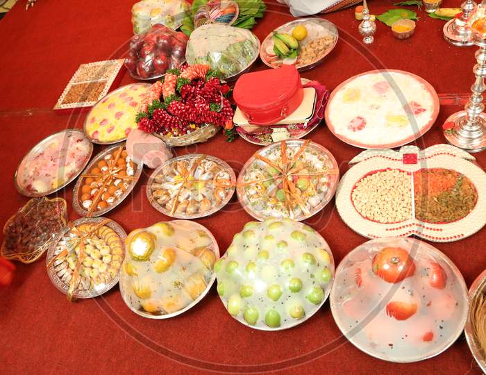 Sweets And Fruits Baskets At An Indian Wedding
