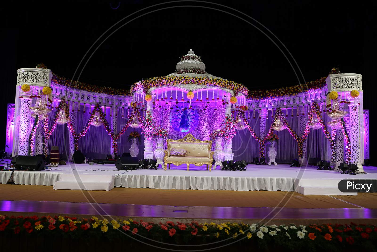 Wedding Reception Decorated Stages with Flowers And Neon Lights