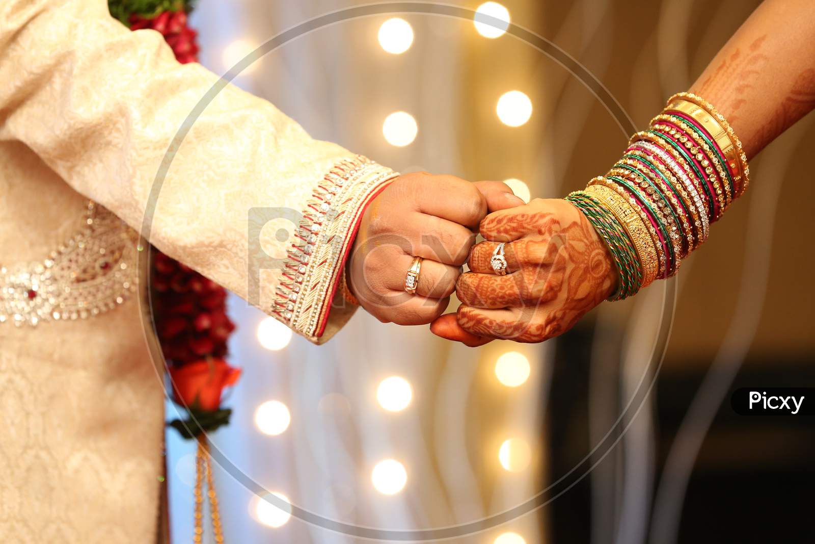 Bride And Bridegroom Holding Hands During Engagement