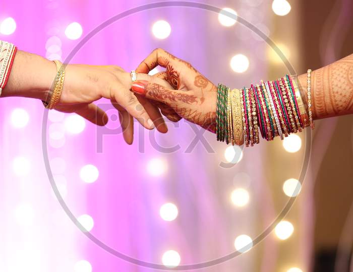 Bride And Bridegroom Holding Hands During Engagement