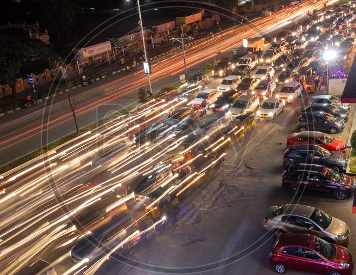 Long Exposure Shot Of Commuting Vehicles At Hi-Tech City Signal In Hyderabad