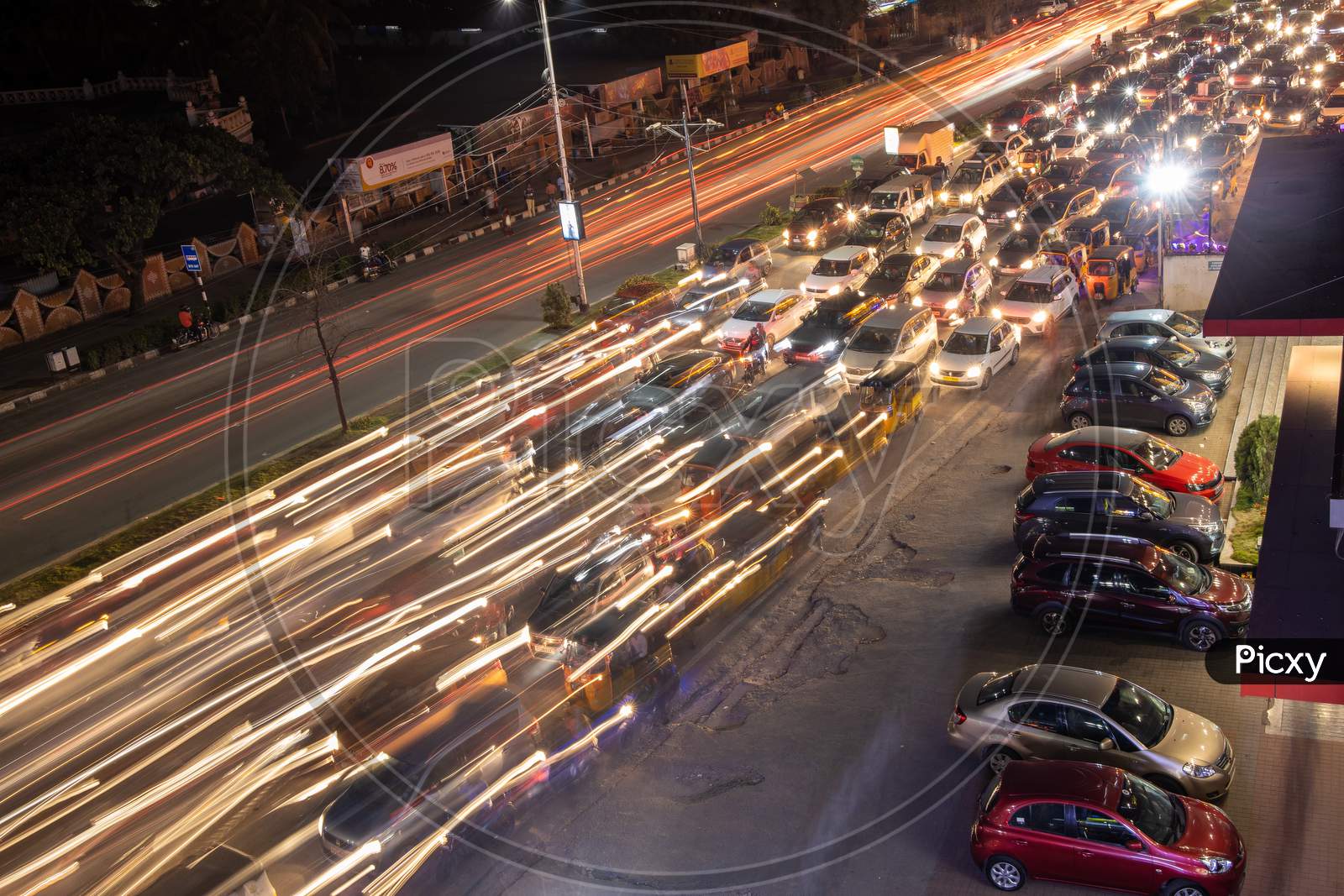 Long Exposure Shot Of Commuting Vehicles At Hi-Tech City Signal In Hyderabad