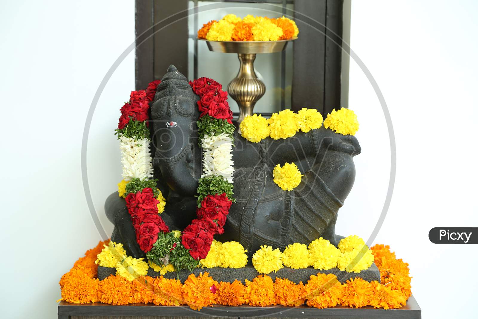 Indian God Lord Ganesh Stone Idol In an House