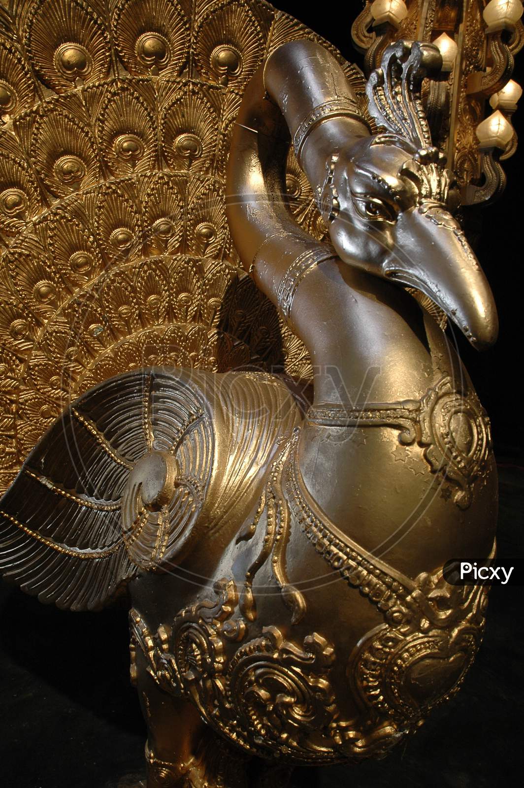 Gold Coated Peacock Idol Closeup