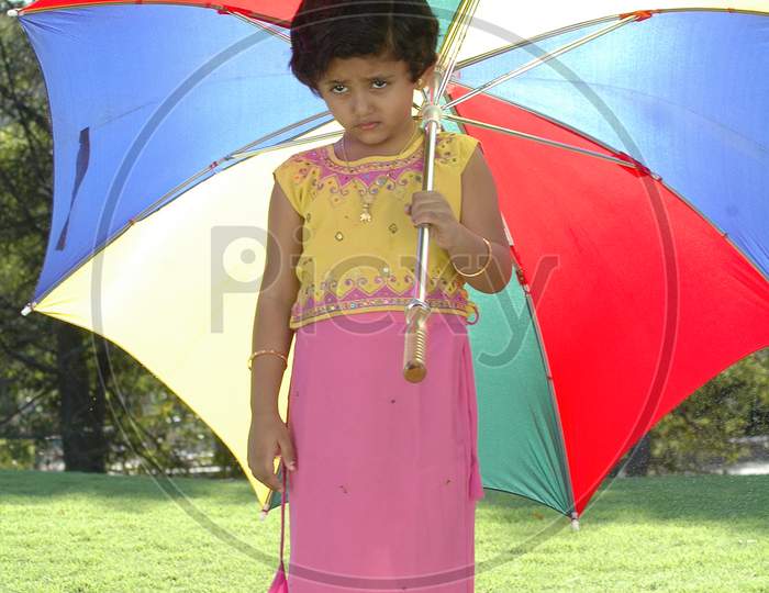 Indian Girl Child Holding an Umbrella