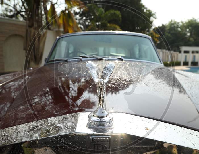 Rolls Royce Car Closeup With Brand Symbol