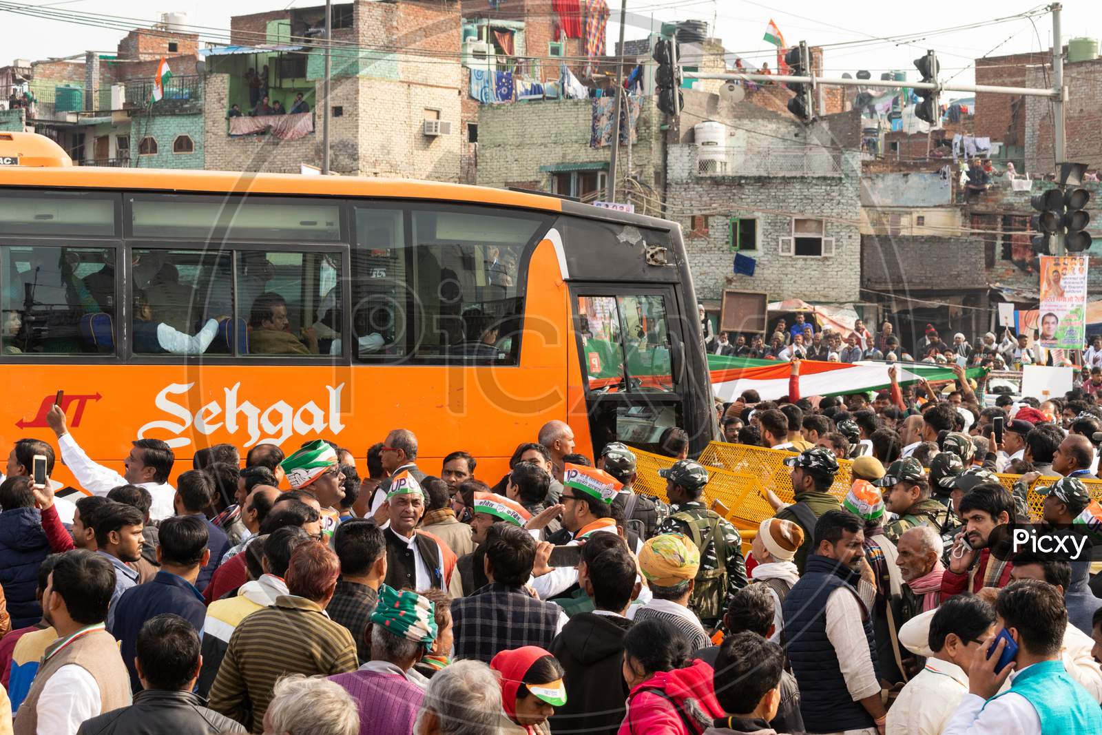 Congress party politicians in a bus and Congress workers with flags during 'Bharat Bachao' rally by Congress in Delhi to highlight Modi govt failures