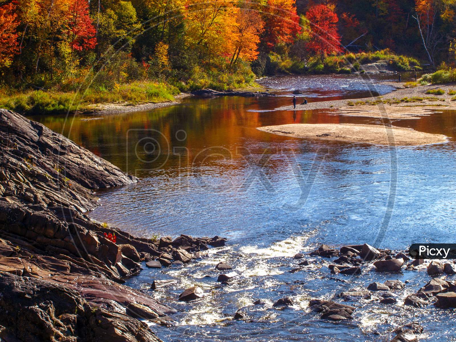 Fishing and relaxing near the river in Fall, Chutes Prov Park, ON, Canada