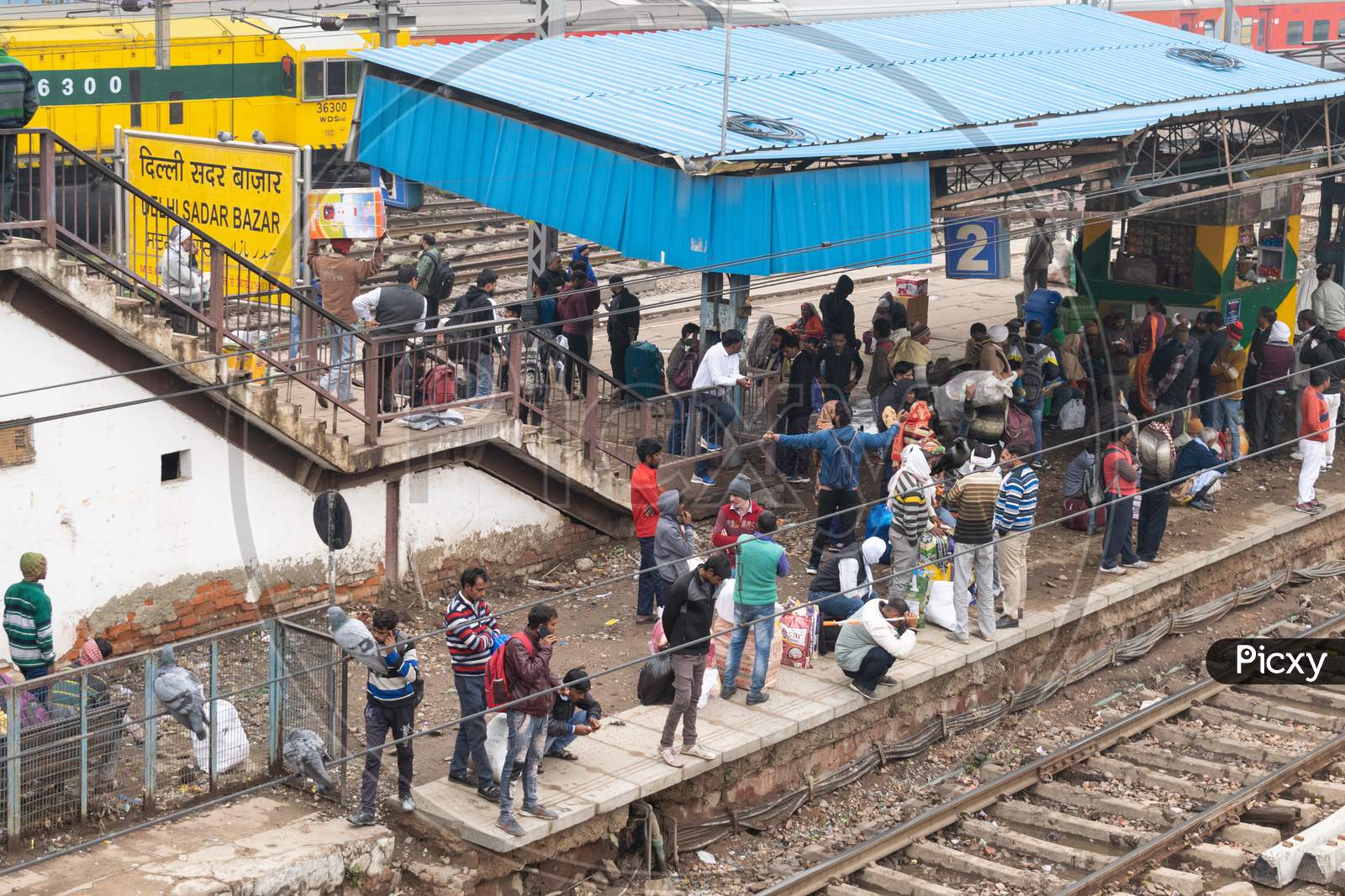 Passengers waiting for the train at the platform at Delhi Sadar Bazar railway station