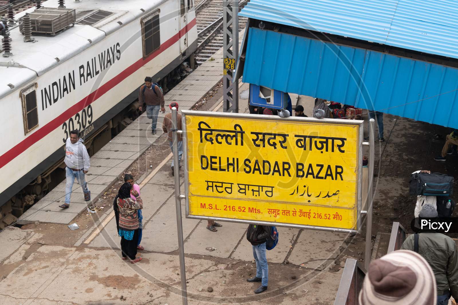 sign board for Delhi sadar bazar railway station and Indian railway engine
