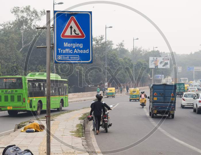 'Merging traffic Ahead' sign board