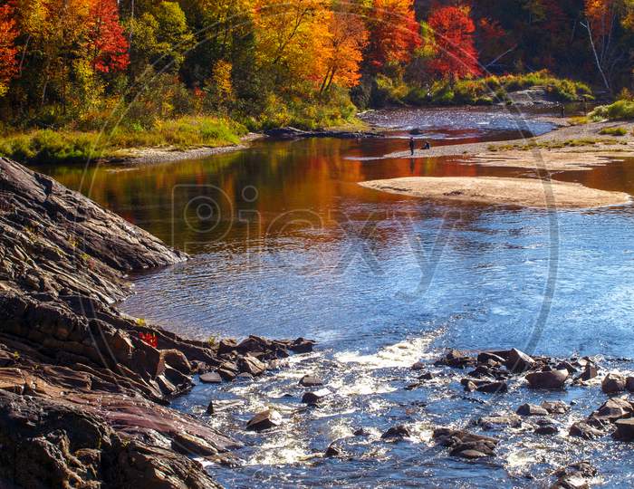 Fishing and relaxing near the river in Fall, Chutes Prov Park, ON, Canada