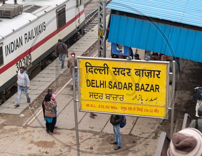 sign board for Delhi sadar bazar railway station and Indian railway engine