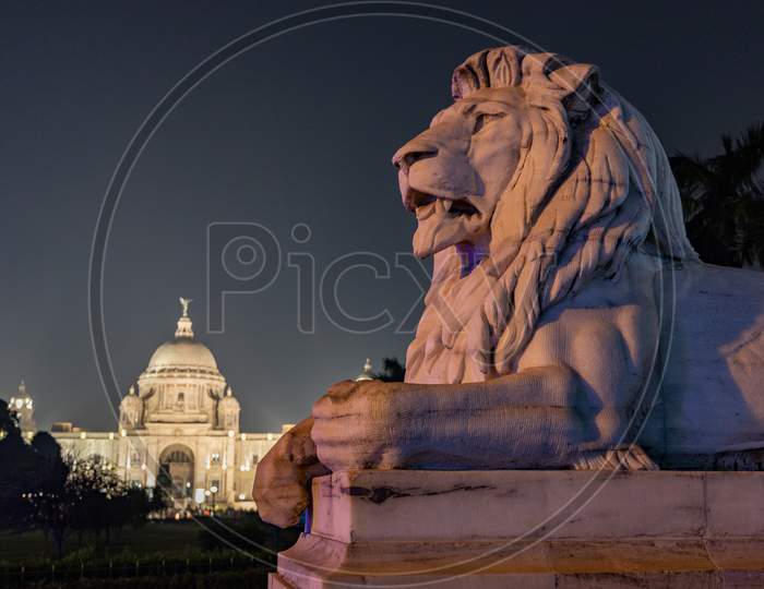 Night View of Iconic Victoria Memorial in Kolkata With Lion Statue Composition
