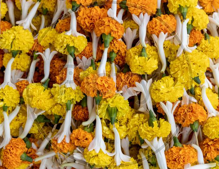 Marigold Flower Garland Closeup Forming a Background