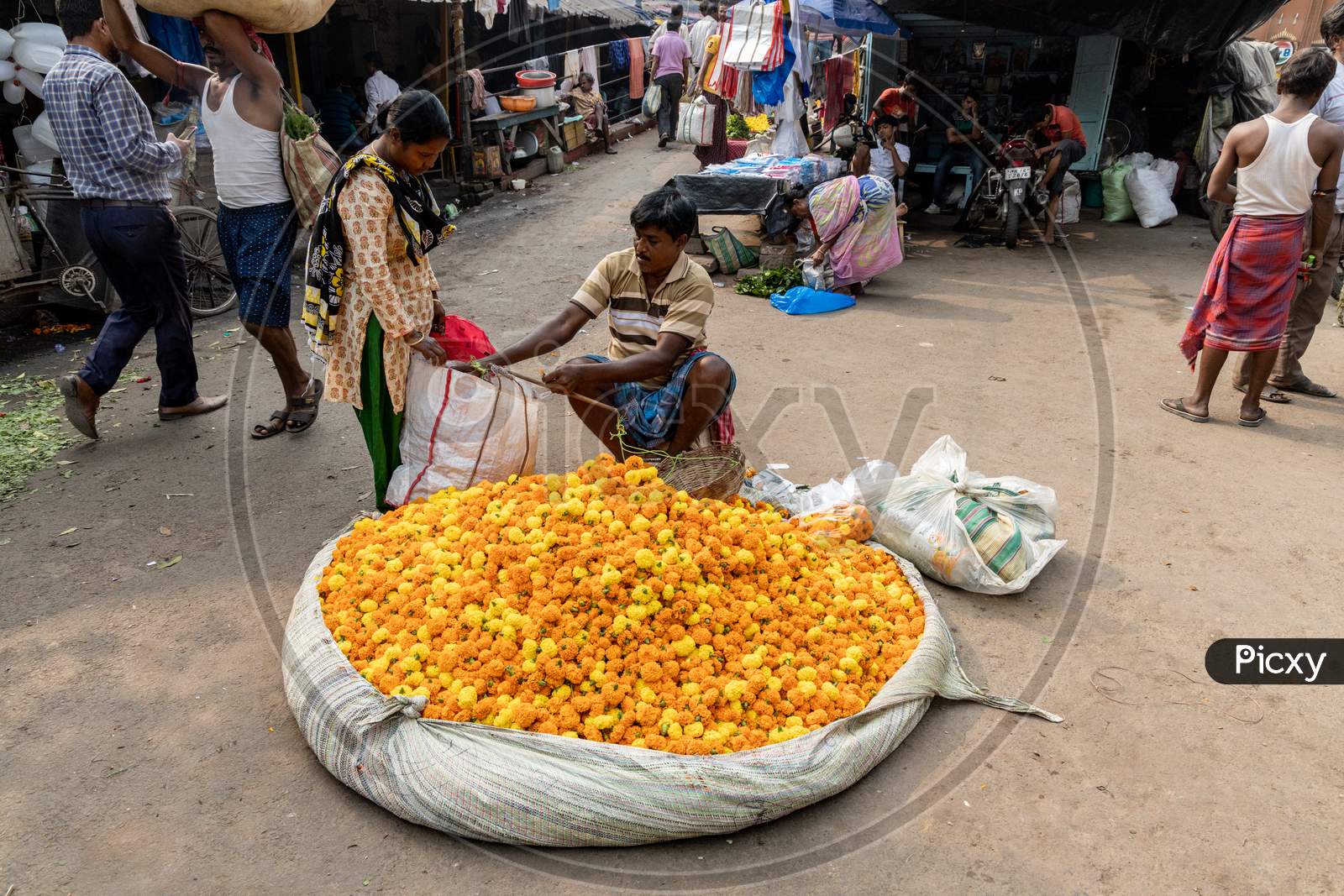 A Vendor Selling Marigold Flowers on Kolkata Streets