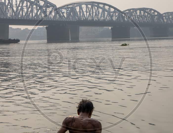 People Bathing in Hooghly River Near Dakshineswar Bally Bridge In Kolkata