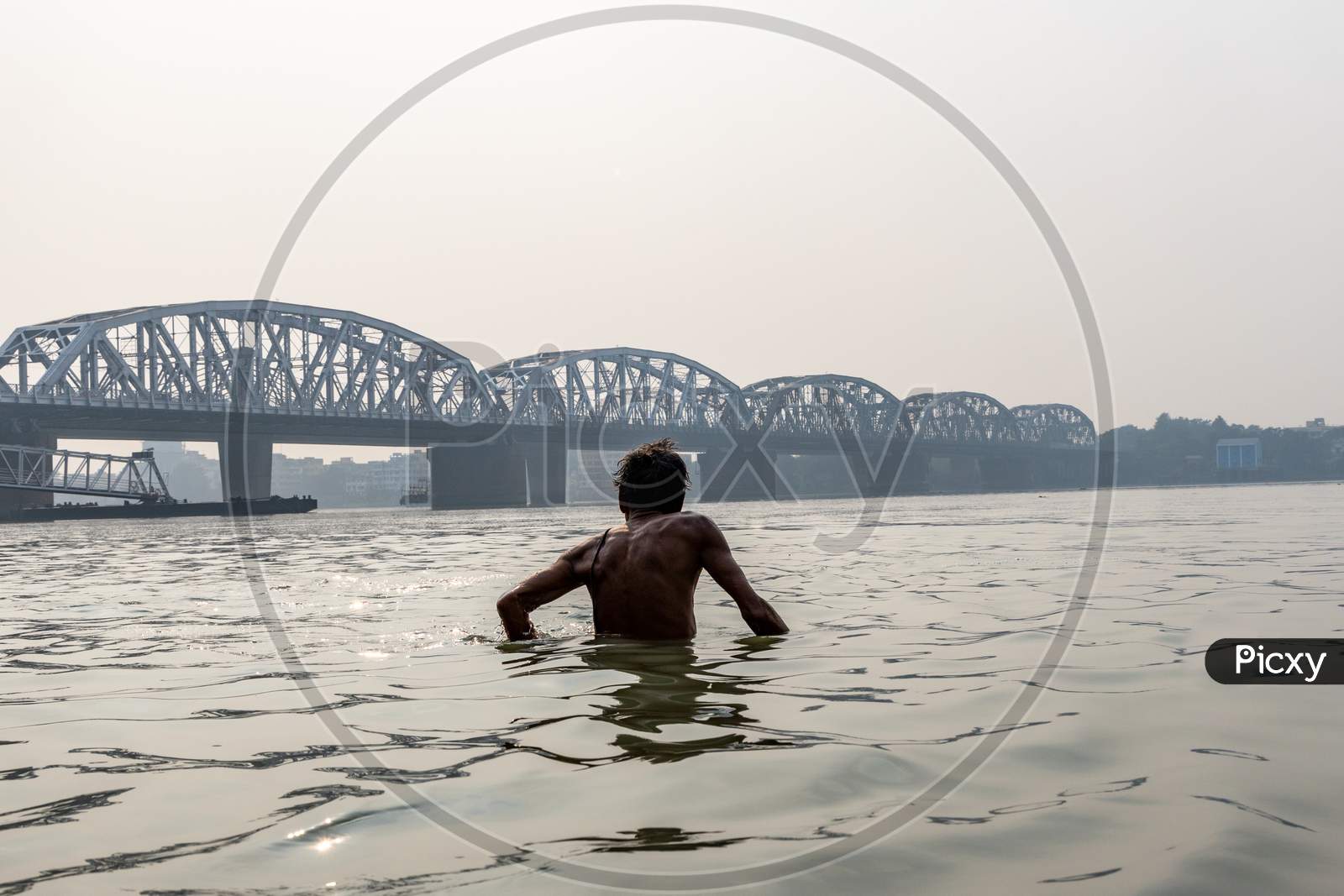 People Bathing in Hooghly River Near Dakshineswar Bally Bridge In Kolkata