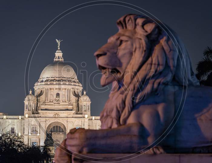Night View of Iconic Victoria Memorial in Kolkata With Lion Statue Composition