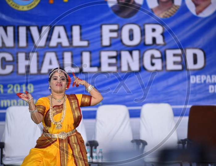 Intellectually challenged kid dancing bharata natyam in a cultural carnival