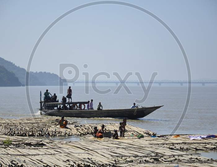 Commuting Old Wooden Boats on Bramhaputra River in Assam
