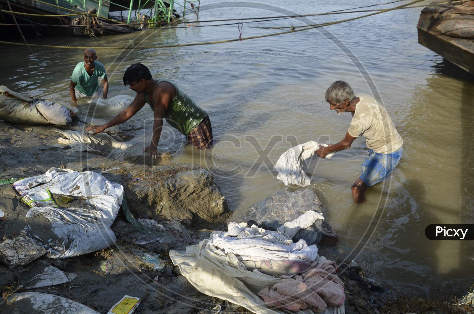washerman or Dhobi Washing Clothes on A River Bank