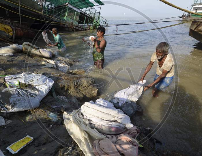 washerman or Dhobi Washing Clothes on A River Bank