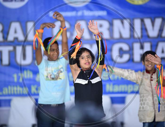 Intellectually challenged kids dancing in an event