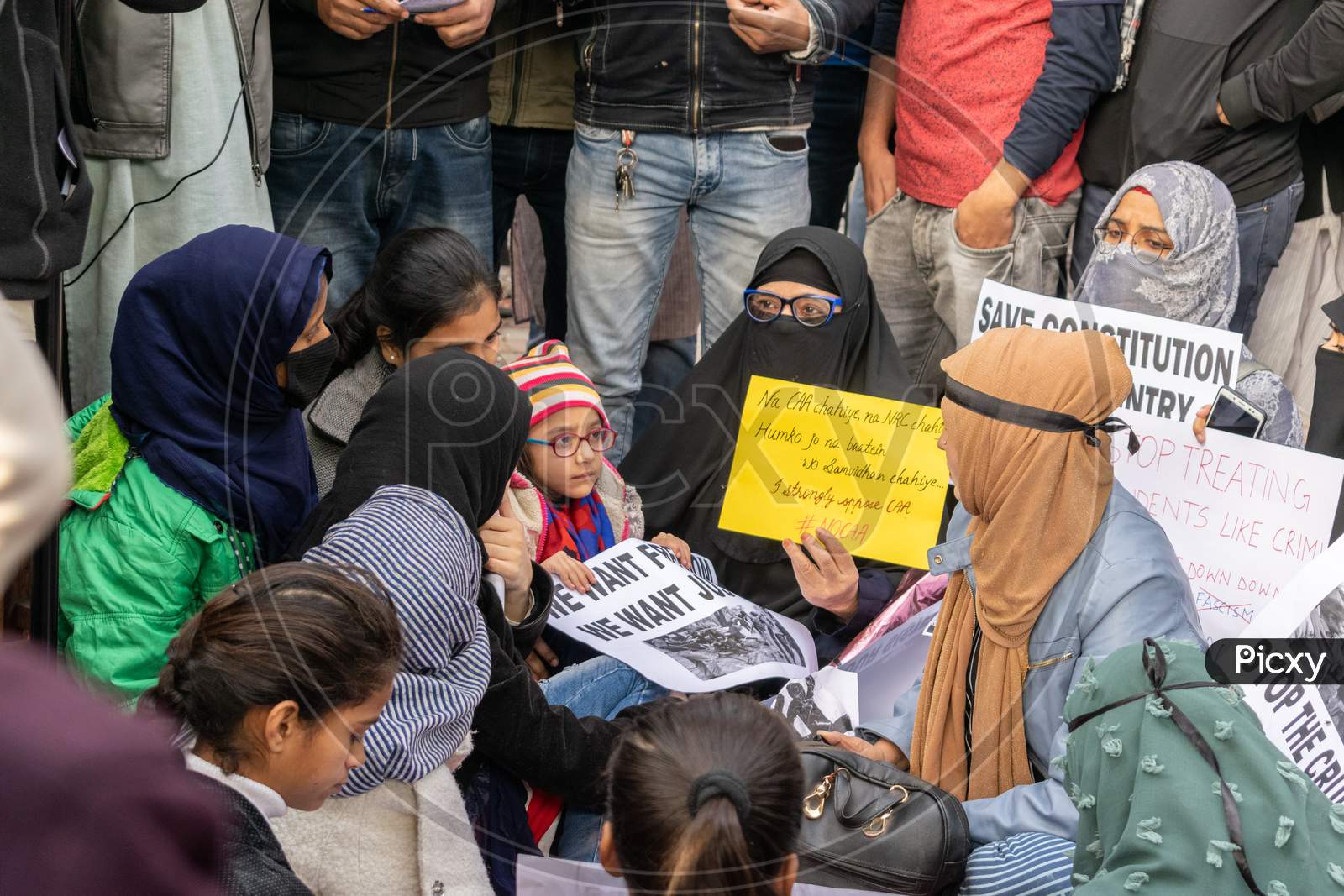 Women with a child Protesting Against Caa And Nrc Outside Jamia Millia Islamia University
