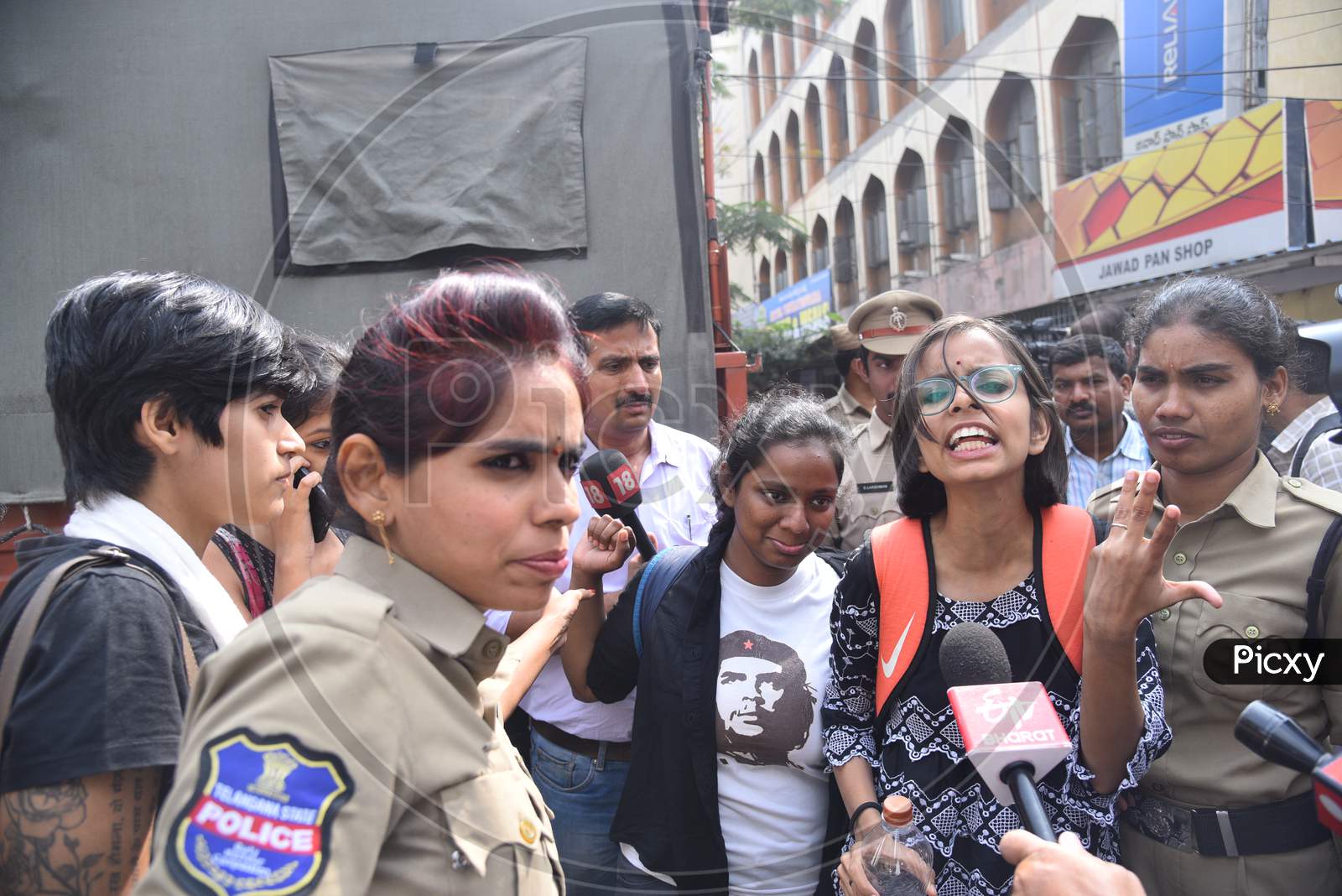 a woman Protester against Citizenship Amendmend Act being detained in vehicles by Hyderabad Police at Exhibition Grounds on 19,December 2019.