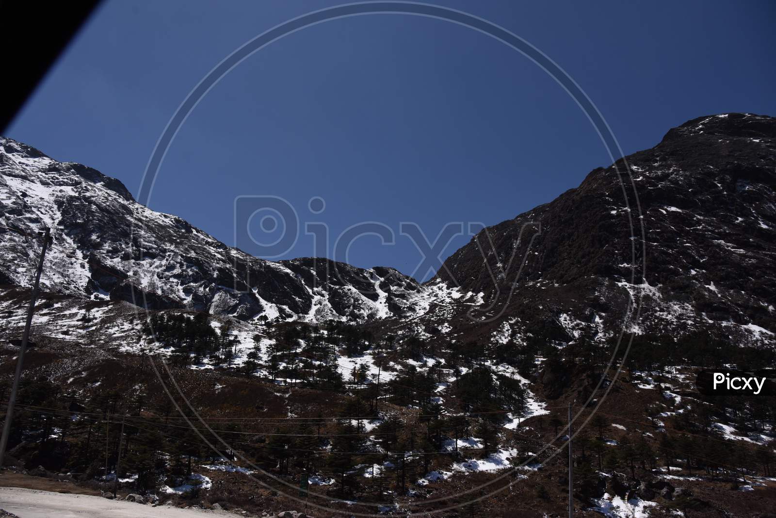 A Landscape n of Snow Filled Mountain Ranges With Valleys In  Arunachal Pradesh