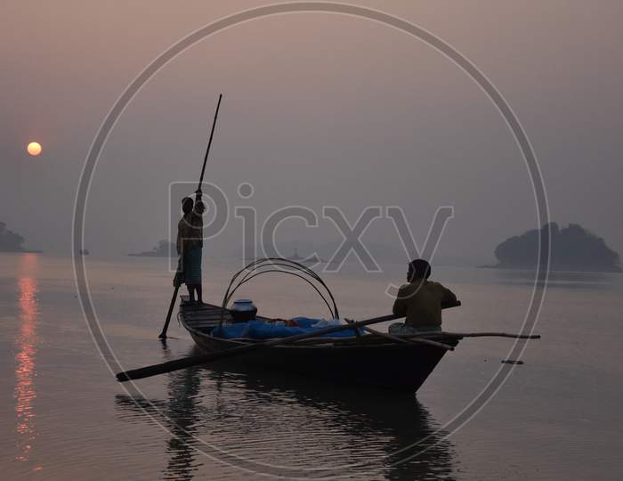 Fisher Man in Boats For  Hunt Of Fishes in Early Hours of  Day on Bramhaputra River in Assam