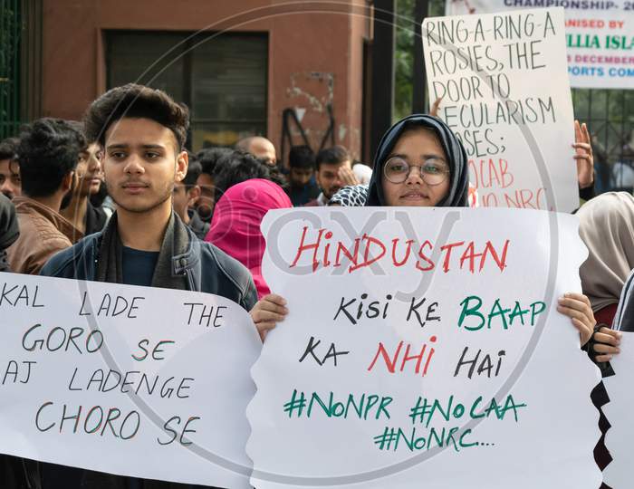 Students with banners In The Protest Against Caa And Nrc Outside Jamia Millia Islamia University