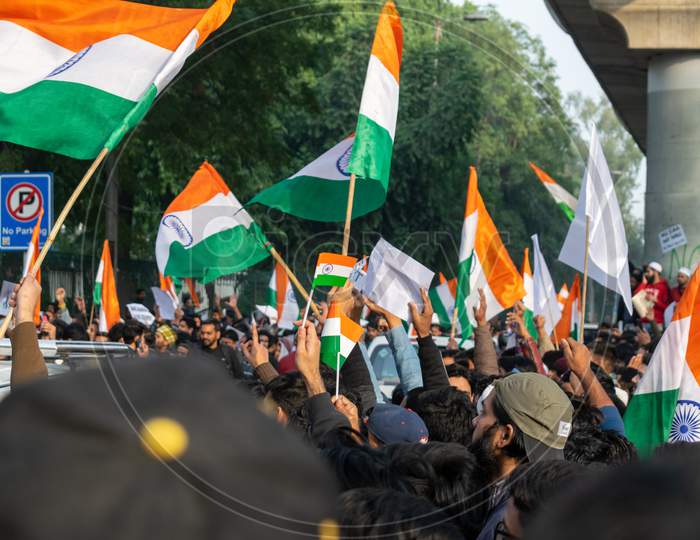 People With Indian Flags banners and posters Protesting Against Caa And Nrc Outside Bab E Maulana Abul Kalam Azad Gate No 7 Jamia Millia Islamia A Central University In New Delhi