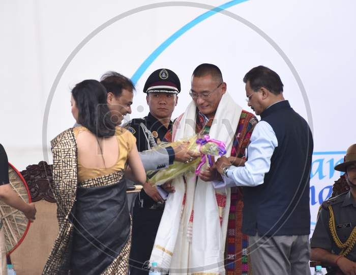 Assam Government Officials Honoring  Bhutan Prime Minister Tshering  Tobgay  At Namami Bramaputra Festival Inauguration Stage In Guwahati in Assam