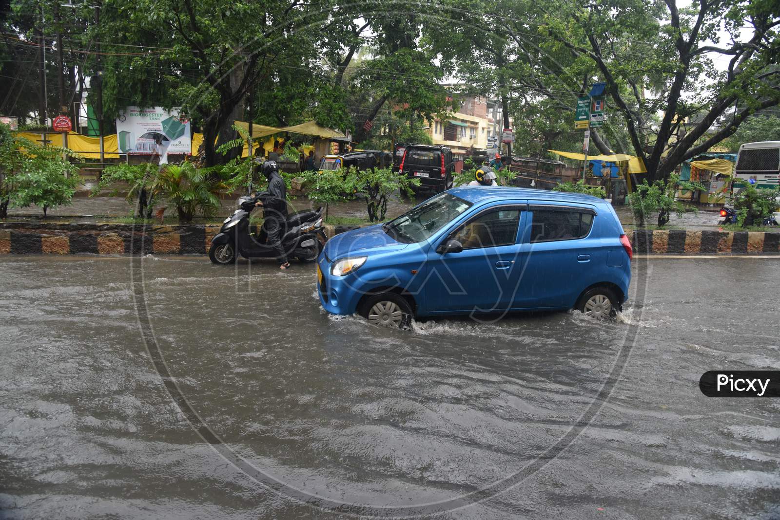Commuting Vehicles Taking Risky  Rides On  Flooded Roads in Assam Due To Seasonal Floods in Guwahati City , Assam On June 13  2017