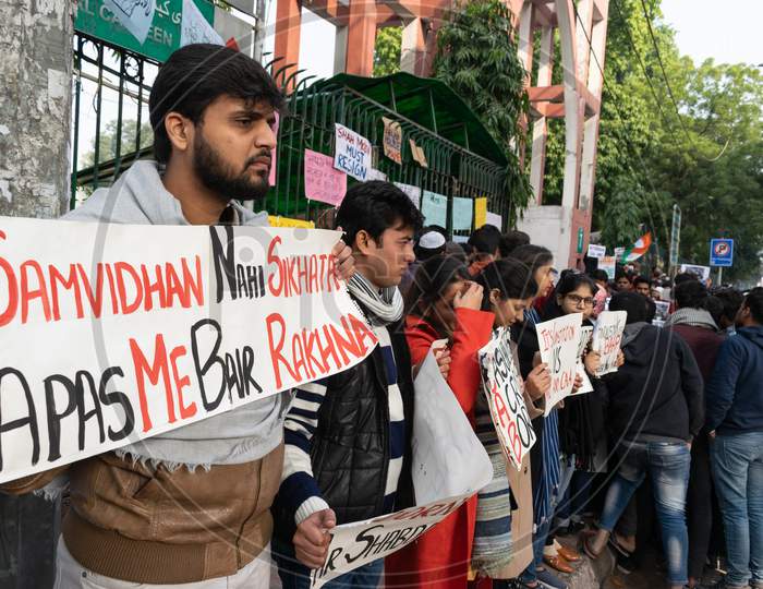 Students with slogans protesting against CAA and NRC outside Jamia Millia Islamia, A Central University in New Delhi