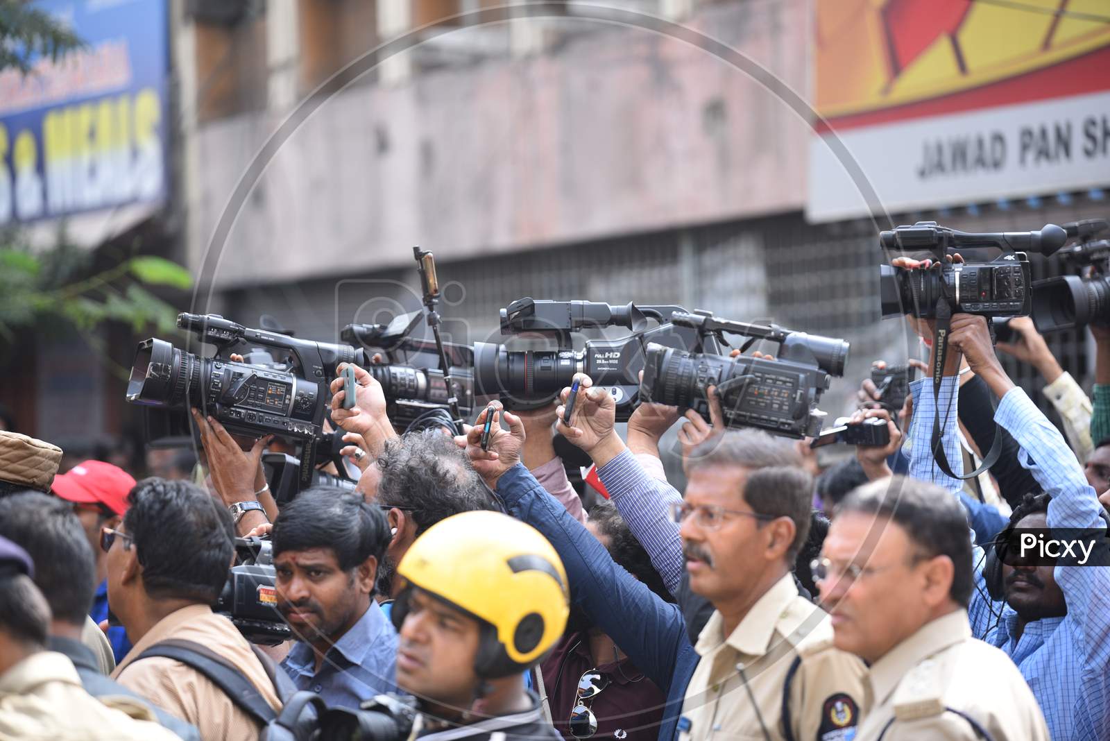 Media and Journalists covering police detentions at exhibition grounds