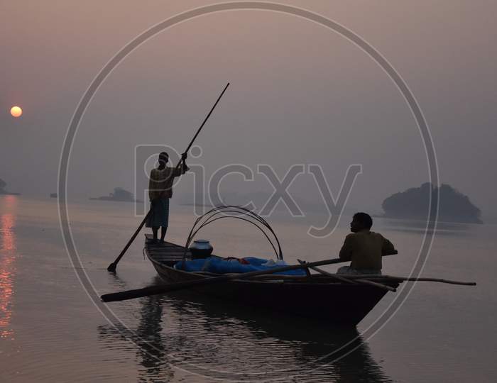 Fisher Man in Boats For  Hunt Of Fishes in Early Hours of  Day on Bramhaputra River in Assam