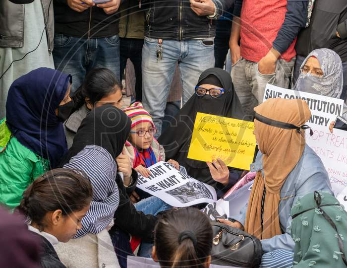 Women with a child Protesting Against Caa And Nrc Outside Jamia Millia Islamia University