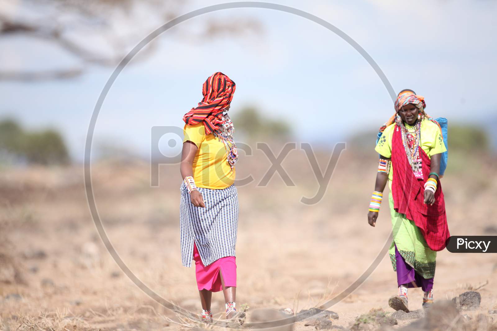 A Couple of African Tribal Women walking