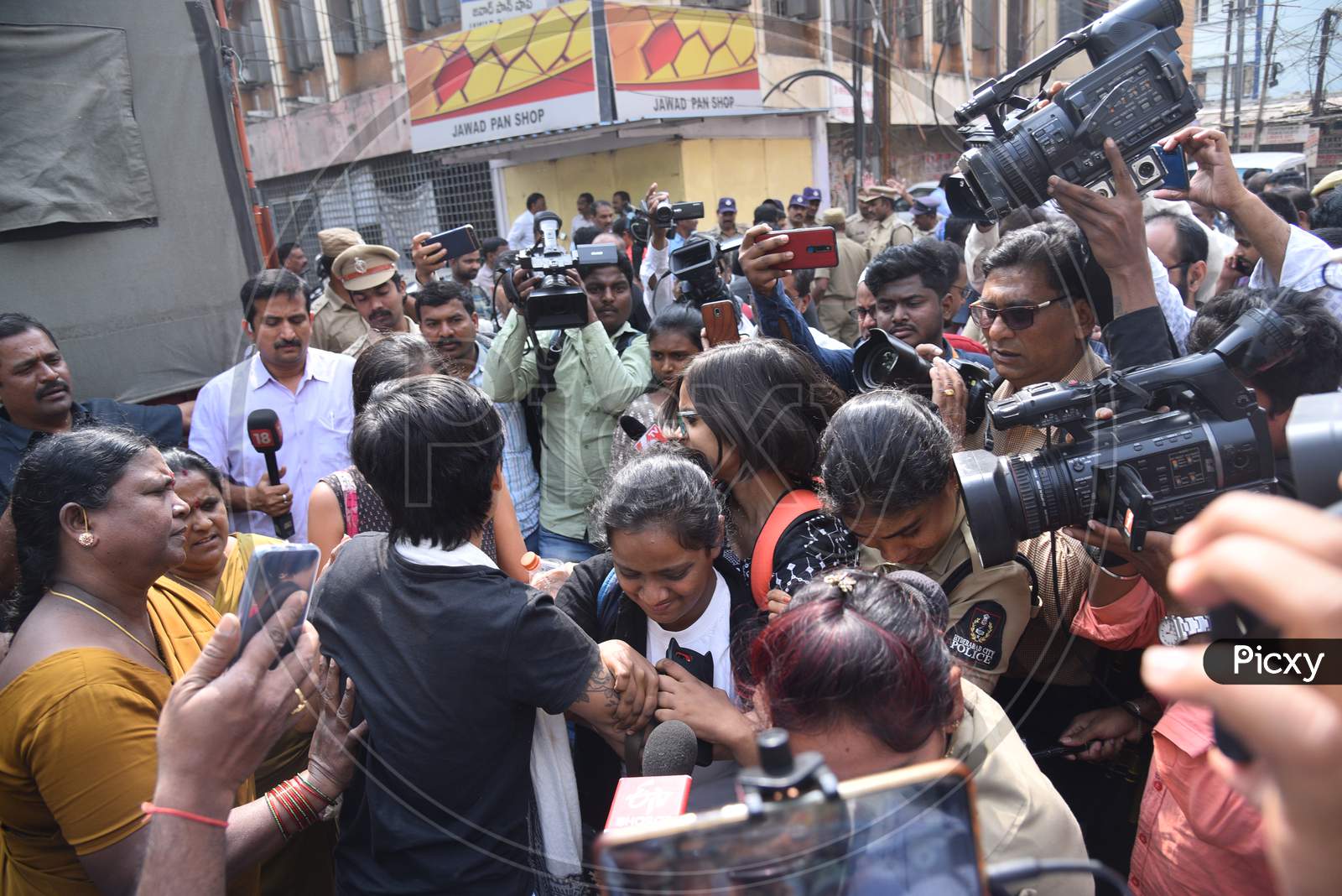 a woman Protester being detained into vehicles by Hyderabad Police who is protesting against Citizenship Amendmend Act at Exhibition Grounds on 19,December 2019.
