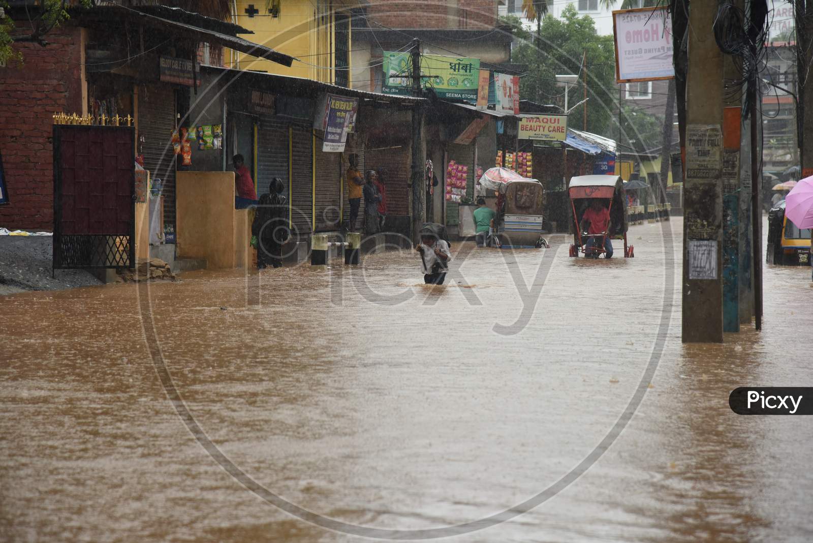 Pedestrians Walking on Flooded Roads  Due To Seasonal Floods In Guwahati City, Assam On June 13 2017