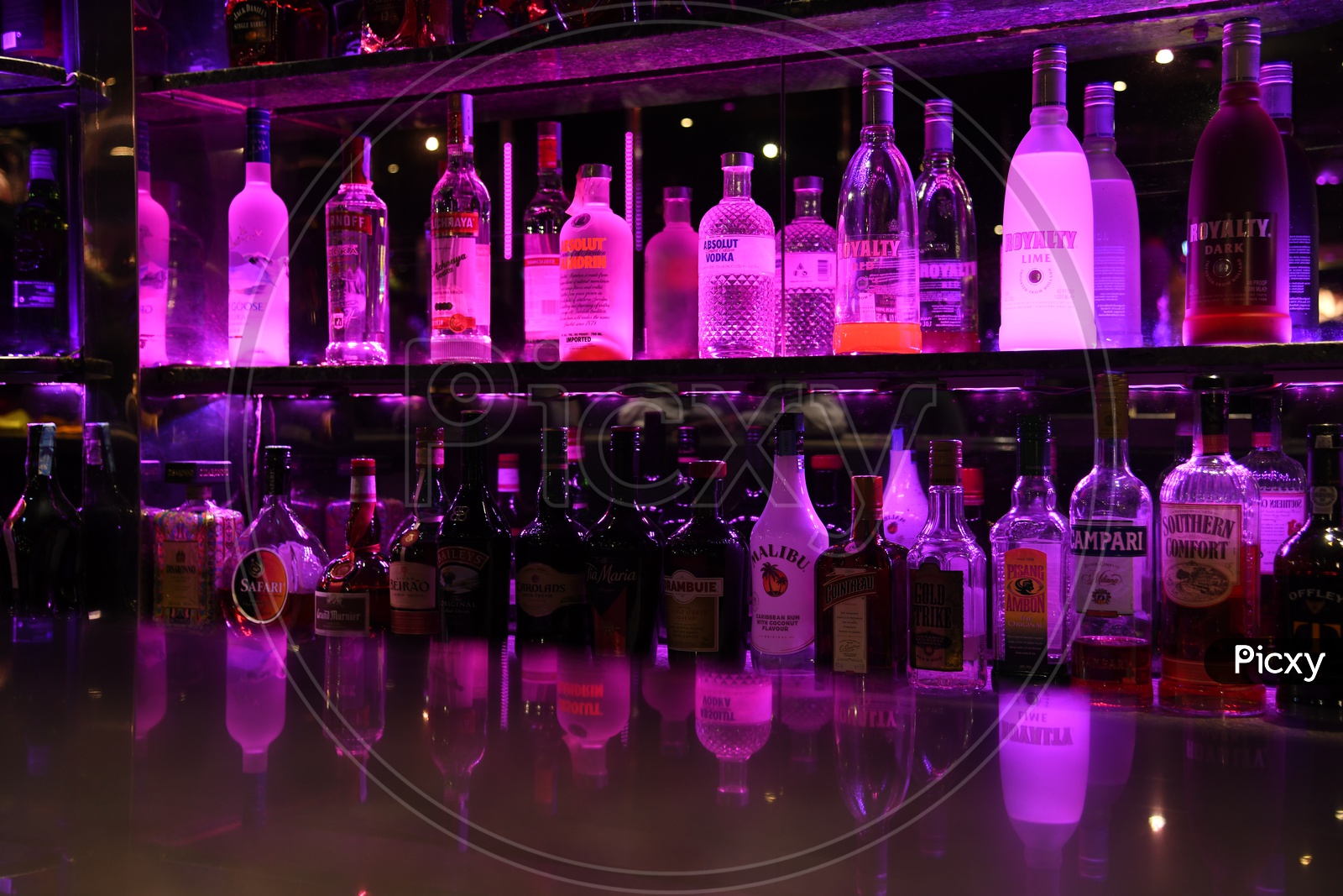 Alcohol or Wine Bottles At a Bar Counter