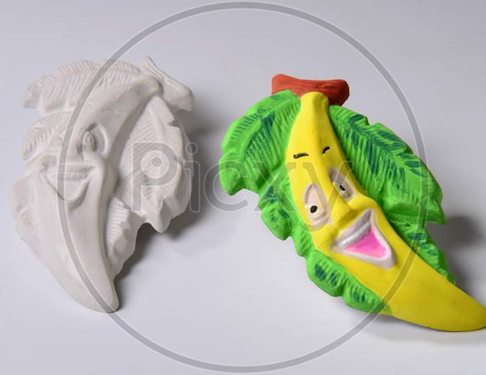 A Banana with a painted face