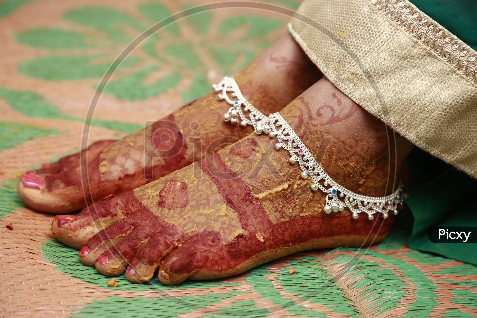 Indian bride legs with anklets and mehendi