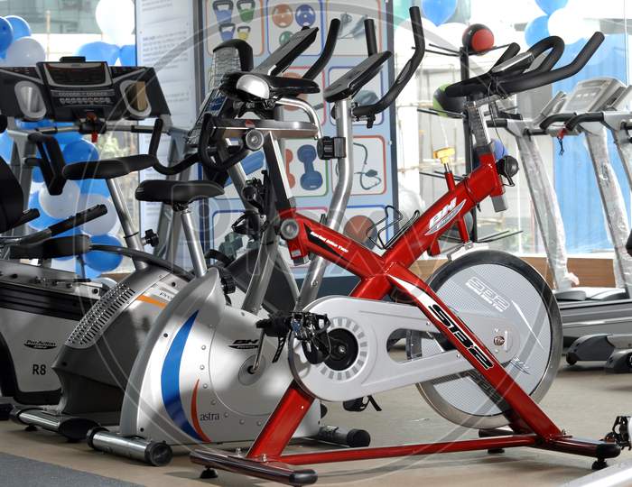 Group of cycling exercise machines in a gym